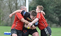 The Wigan defence stop a break by Tarleton's Sam Cleaver