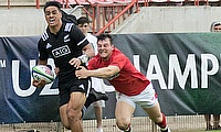 New Zealand winger Bailyn Sullivan tries to race away from the Wales defence on day two of the World Rugby U20 Championship 2018