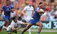 Samoa's Alatasi Tupou cuts through the England defense on day one of the HSBC World Rugby Sevens Series in Hamilton