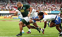 South Africa's Zain Davids charges through the Samoa defence to score a try in their Cup semi-final on day three of the Emirates Airline Dubai Rugby S