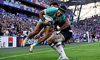 Kurt-Lee Arendse of South Africa scores his team's second try ahead of Blair Kinghorn of Scotland