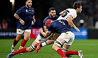 Andre Van der Bergh of Namibia is tackled by Charles Ollivon and Thibaud Flament of France