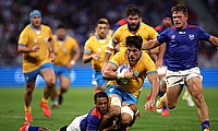 Carlos Deus of Uruguay is tackled by Damian Stevens of Namibia