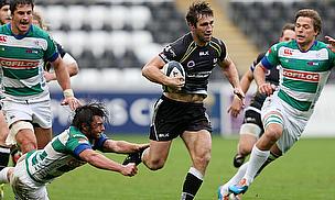 Andrew Bishop (centre) charges through for Ospreys