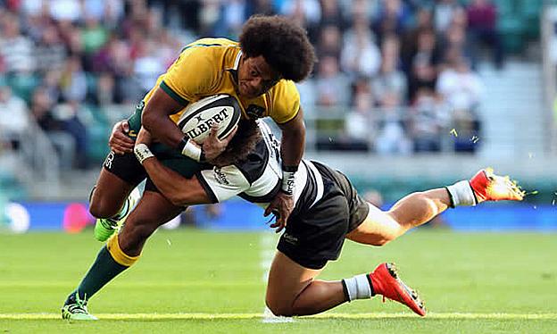 Henry Speight of Australia is tackled by Tim Nanai-Williams