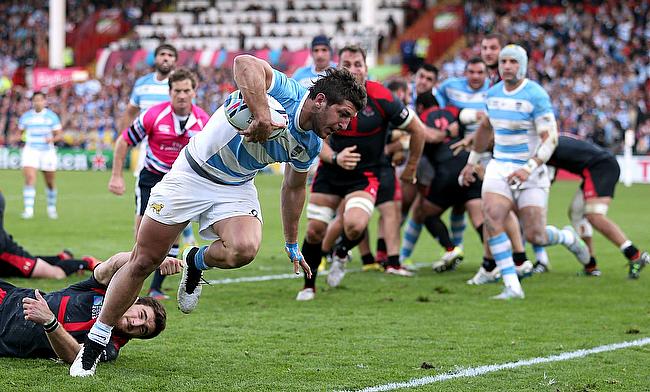 Argentina's Tomas Cubelli breaks through to score in their 54-9 World Cup victory over Georgia