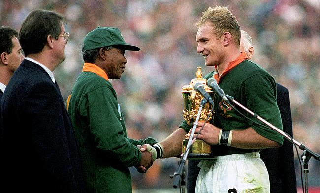 South Africa captain Francois Pienaar receives the World Cup from Nelson Mandela