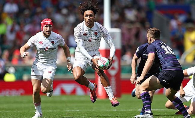 England's Ryan Olowofela attacks against the Scotland defense on day one of the HSBC World Rugby Sevens Series at Twickenham Stadium during London 7s