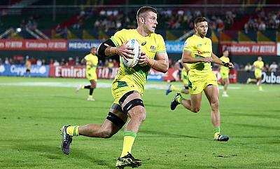 Australia captain Nick Malouf attacks against the Scotland defence on day one of the Emirates Airline Dubai Rugby Sevens