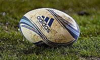 A rugby ball lies on the floor