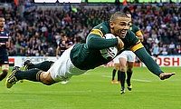 South Africa's Bryan Habana dives in to bring up his hat-trick