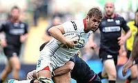 Chris Henry of Ulster is tackled by Sam Davies of Ospreys