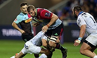 Harlequins' Chris Robshaw is tackled by Montpellier's Benoit Paillaugue in Lyon