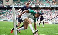 Ireland's Jordan Conroy scores a try against Scotland on day one of the HSBC World Rugby Sevens Series at Twickenham Stadium in London