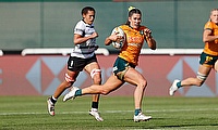 Australia co-captain Charlotte Caslick cuts through the Fiji defense for a try on day two of the Dubai Emirates Airline Rugby Sevens at The Sevens Sta