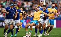 Gaston Mieres of Uruguay is tackled by Ange Capuozzo of Italy