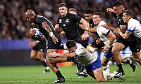 Mark Telea of New Zealand is tackled by Luca Morisi of Italy during the game against Italy