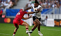 Waisea Nayacalevu of Fiji fends off Akaki Tabutsadze of Georgia