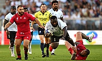 Luke Tagi of Fiji is tackled by Beka Gigashvili of Georgia during the Rugby World Cup game