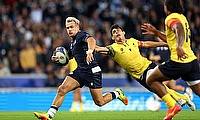 Darcy Graham of Scotland breaks through the Romania defence to score the team's third try during the Rugby World Cup