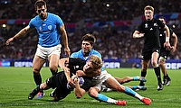 Damian McKenzie of New Zealand scores his team's first try whilst being tackled by Santiago Arata of Uruguay