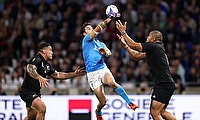 Felipe Etcheverry of Uruguay competes for the high ball with Ofa Tuungafasi and Codie Taylor of New Zealand