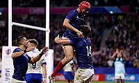 Damian Penaud of France celebrates scoring his team's fourth try with teammate Louis Bielle-Biarrey during the game against Italy