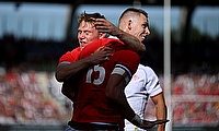 Liam Williams of Wales celebrates with Sam Castelow of Wales after scoring his team's second try against Georgia