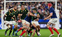 Cheslin Kolbe of South Africa is tackled by Charles Ollivon of France during the Rugby World Cup quarter-final