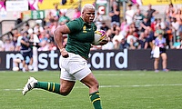 Aseza Hele of South Africa runs with the ball before scoring her team's second try during the Women's Rugby World Cup 2025 Pool D match