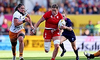 Sophie de Goede of Canada runs with the ball whilst under pressure from Michaela Leonard of Australia