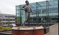 A statue for Sir Billy Boston in Wigan's Believe Square next to Wigan Town Hall.