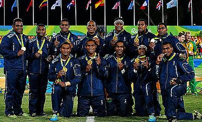 Fiji team posing with their gold medal after winning the Olympic rugby sevens