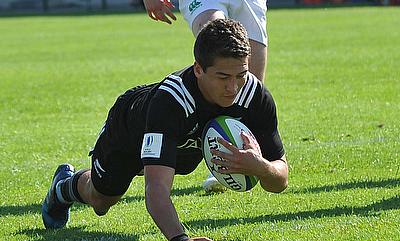 New Zealand fly-half Tiaan Falcon dives over to score one of their 11 tries against Ireland at AIA Arena
