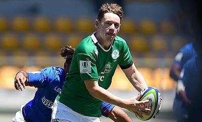 Ireland full-back Alan Tynan looks to pass during their ninth place semi-final with Samoa