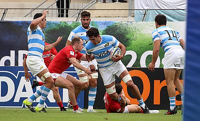 Argentina number eight Santiago Ruiz tries to shrug off a Wales tackle in their fifth place semi-final
