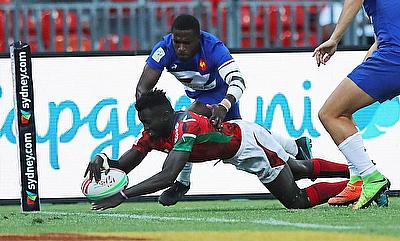 Kenya's Mark Ruga dives in a try against France on day one of the HSBC World Rugby Sevens Series in Sydney