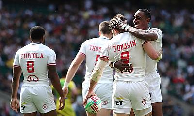 USA's Steve Tomasin and Perry Baker celebrate the match winning try against Australia on day one of the HSBC World Rugby Sevens Series at Twickenham S