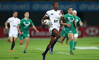 USA's Perry Baker races away from the Ireland defence for a try on day one of the Emirates Airline Dubai Rugby Sevens