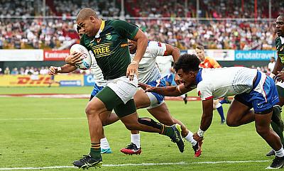 South Africa's Zain Davids charges through the Samoa defence to score a try in their Cup semi-final on day three of the Emirates Airline Dubai Rugby S