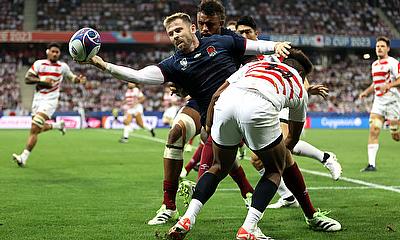 Elliot Daly of England is tackled by Kotaro Matsushima of Japan