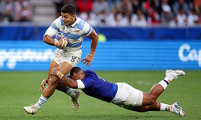 Santiago Chocobares of Argentina is tackled by Alai D'Angelo Leuila of Samoa during the Rugby World Cup game