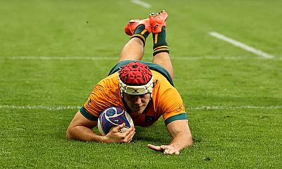 Fraser McReight of Australia scores his team's fourth try during the Rugby World Cup game against Portugal