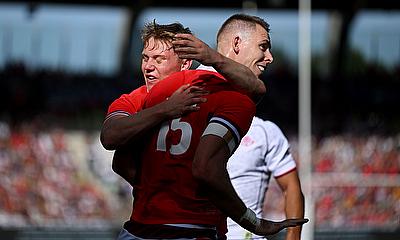 Liam Williams of Wales celebrates with Sam Castelow of Wales after scoring his team's second try against Georgia