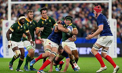 Cheslin Kolbe of South Africa is tackled by Charles Ollivon of France during the Rugby World Cup quarter-final