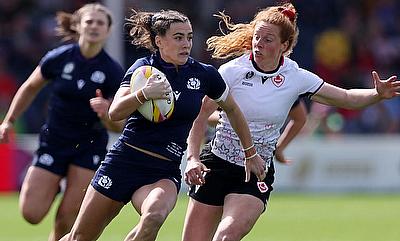 Francesca McGhie of Scotland runs with the ball whilst under pressure from Alex Tessier of Canada during the Women's Rugby World Cup 2025 Pool B matc