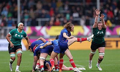 Pauline Bourdon Sansus of France kicks the ball clear from a ruck