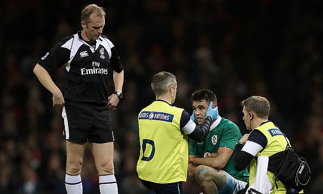 Conor Murray, pictured centre, needed treatment after suffering a shoulder injury in Wales