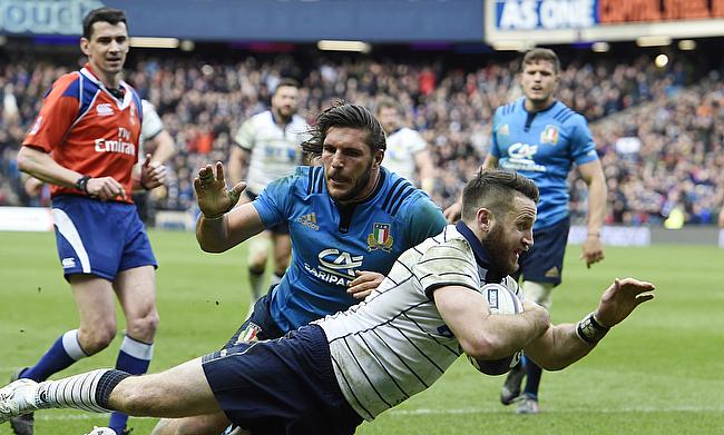 Scotland's Tommy Seymour dives over to score Scotland's fourth try