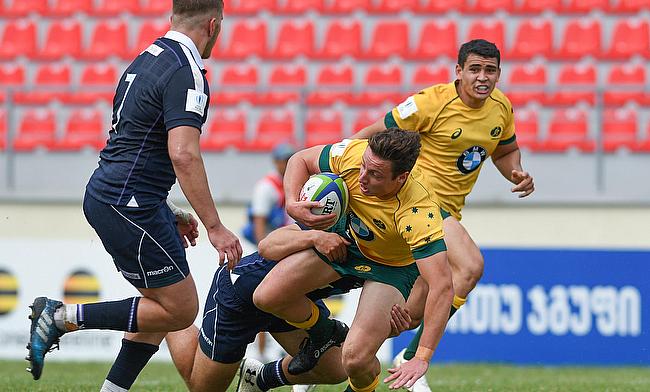 Australia's Nick Jooste is tackled in their fifth place play-off with Scotland at Avchala Stadium
